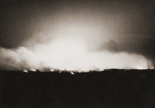 Clydebank ablaze, in the centre can be seen a silhouette of Singers Claock